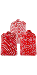3 sacos plásticos do presente do Natal vermelho desproporcionado